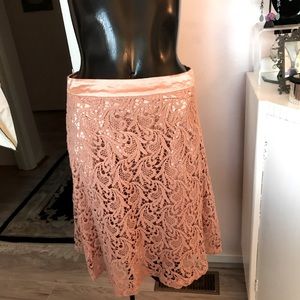 Size small cotton lace with matching petal pink satin lining vintage skirt.